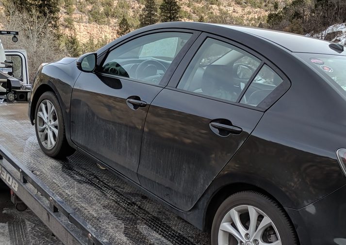 After rock in the road blew a whole in our oil pan we had to get towed to Montrose, Colorado.