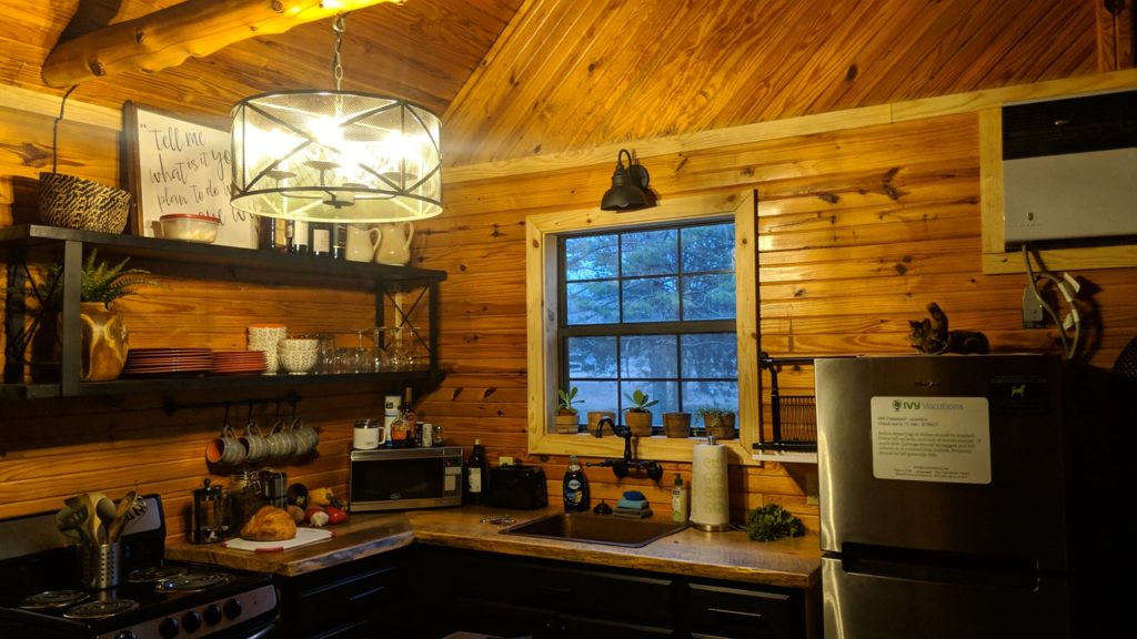 The beautiful, rustic kitchen of the Livingston Creek Cabin in Mountain View, Arkansas.