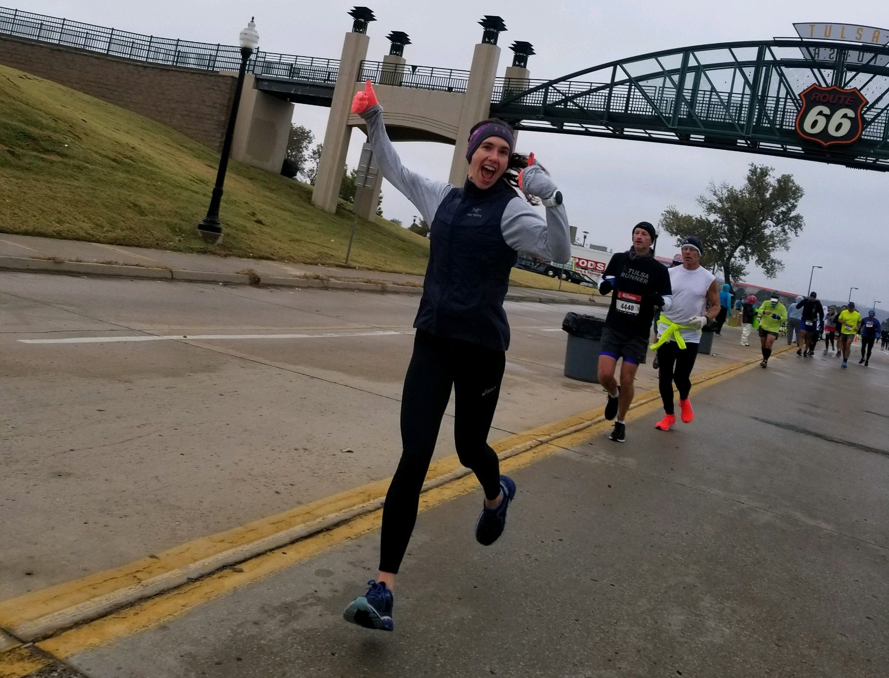 Throwing my hands up in excitement about how well my second marathon was going despite less-than ideal conditions.