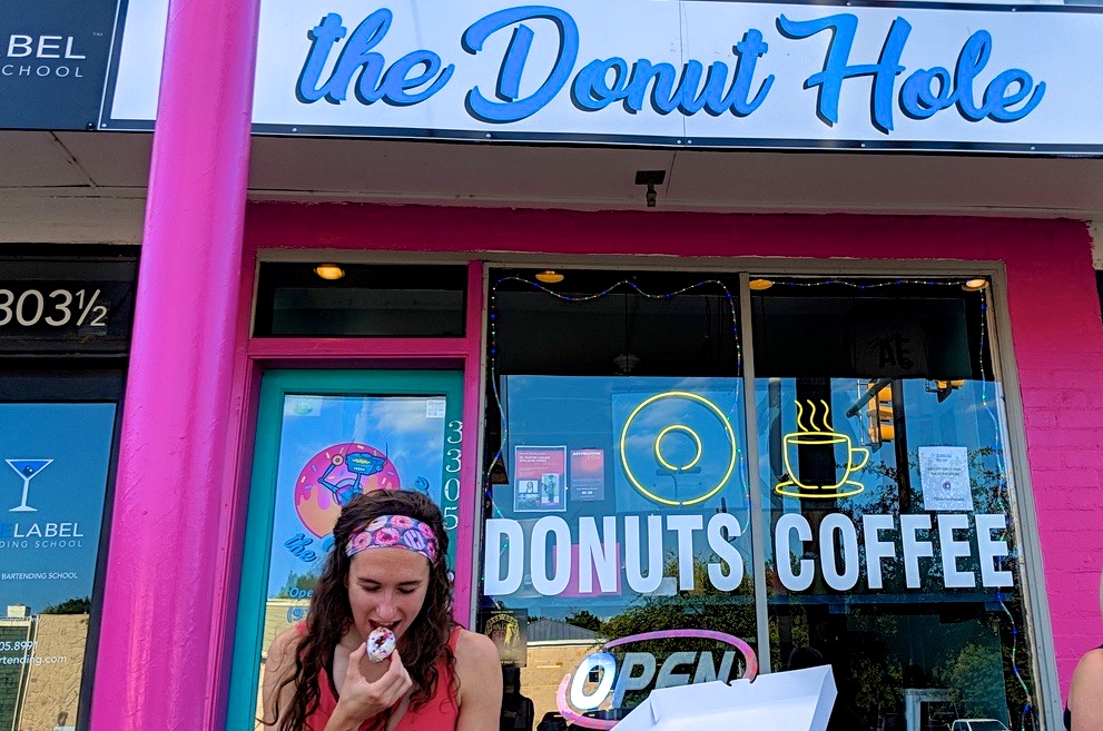 Enjoying a donut from the Donut from the Donut Hole on Brookside in Tulsa.