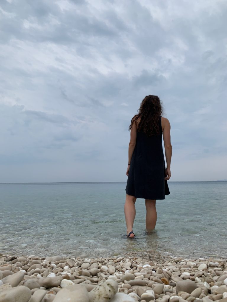 Walking alone, beach view on Hvar Island in Croatia.