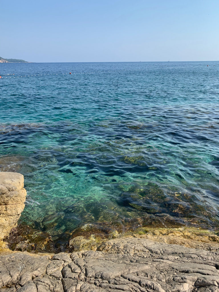 Beach and blue water in Dubrovnik, Croatia